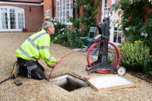 Professional drain clearance company unblocking a drain