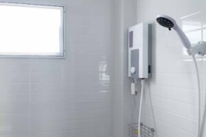 electric shower on bathroom wall