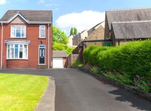 tarmac driveway with raised flower beds
