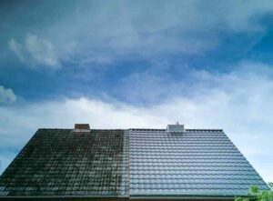 Half clean roof, half covered in moss