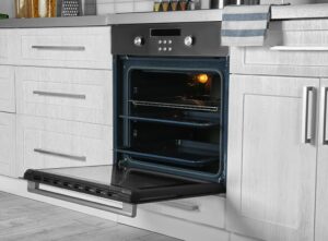 A built-in single oven beneath a hob
