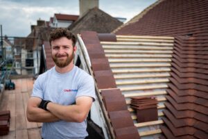 Checkatrade approved roofer next to a tile roof